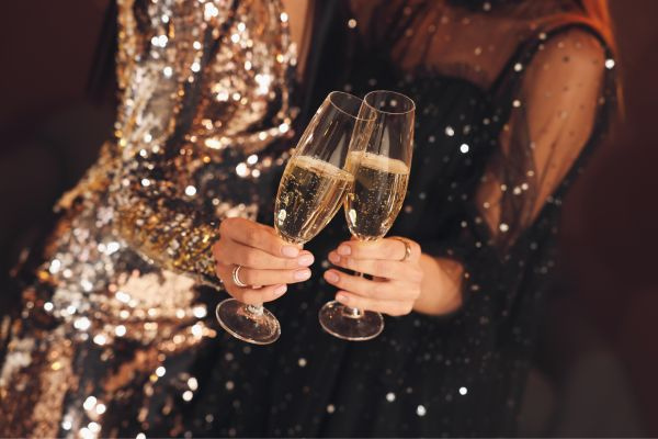 Champaign Flutes Touching at Hogmanay Gala Ball during New Year at Mar Hall near Glasgow, Scotland